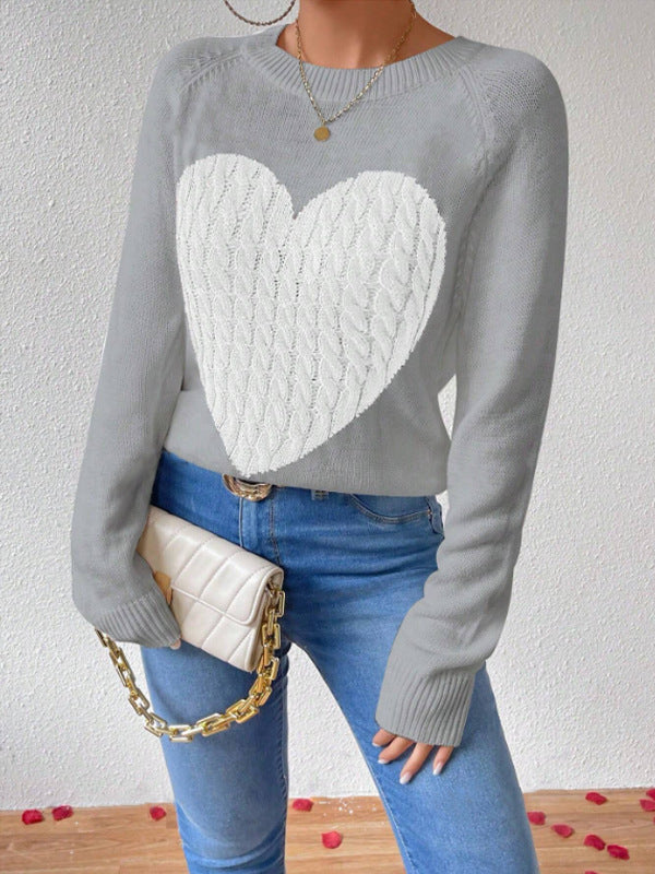 Grey - Women's crew neck knit sweater featuring a large contrasting cable-knit heart motif on the front, complete with raglan sleeves and ribbed trims.