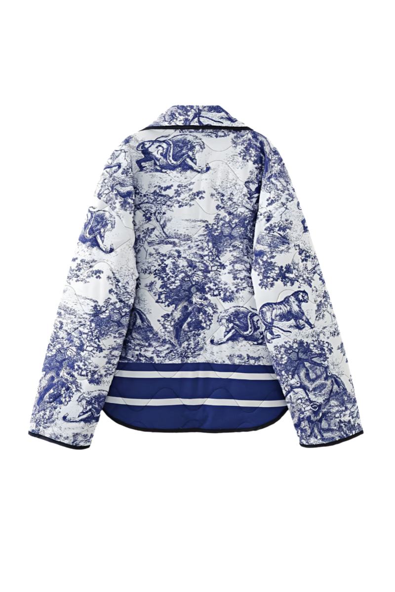 Women's oversized quilted jacket featuring a navy and white toile scenic print, open front, and contrast striped borders on the wide sleeves and hem.