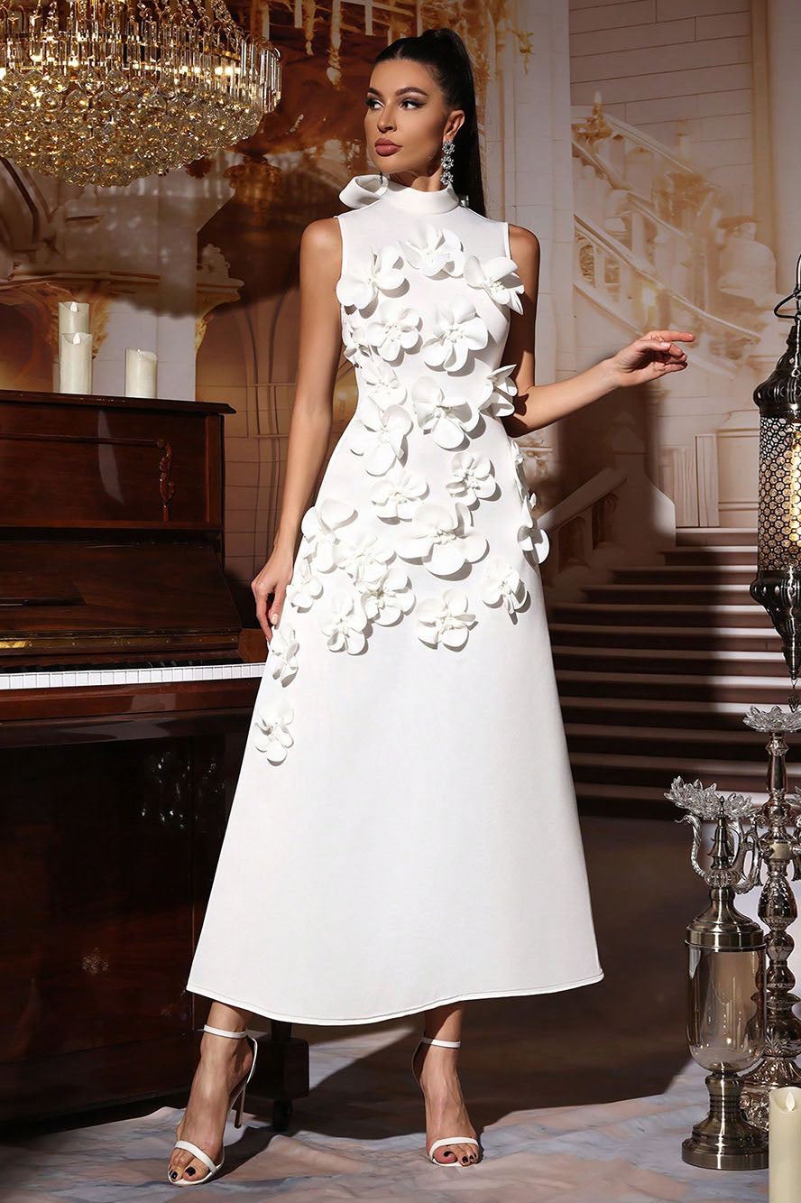 Woman in pink crepe gown with 3D floral appliques