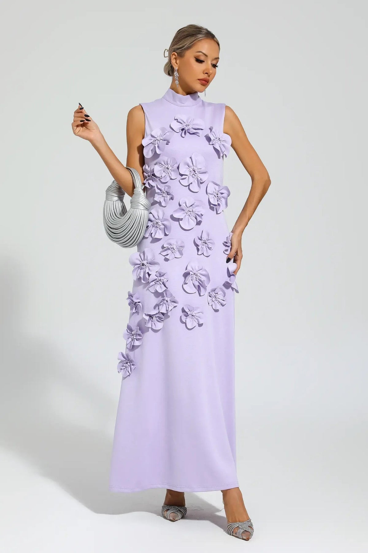 Woman in pink crepe gown with 3D floral appliques