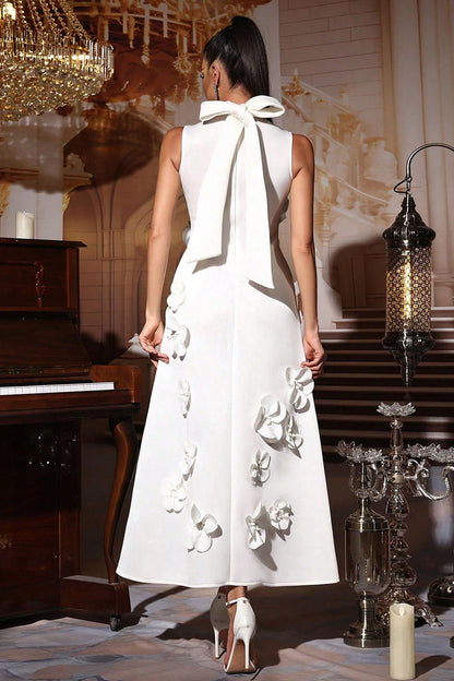 Woman in pink crepe gown with 3D floral appliques