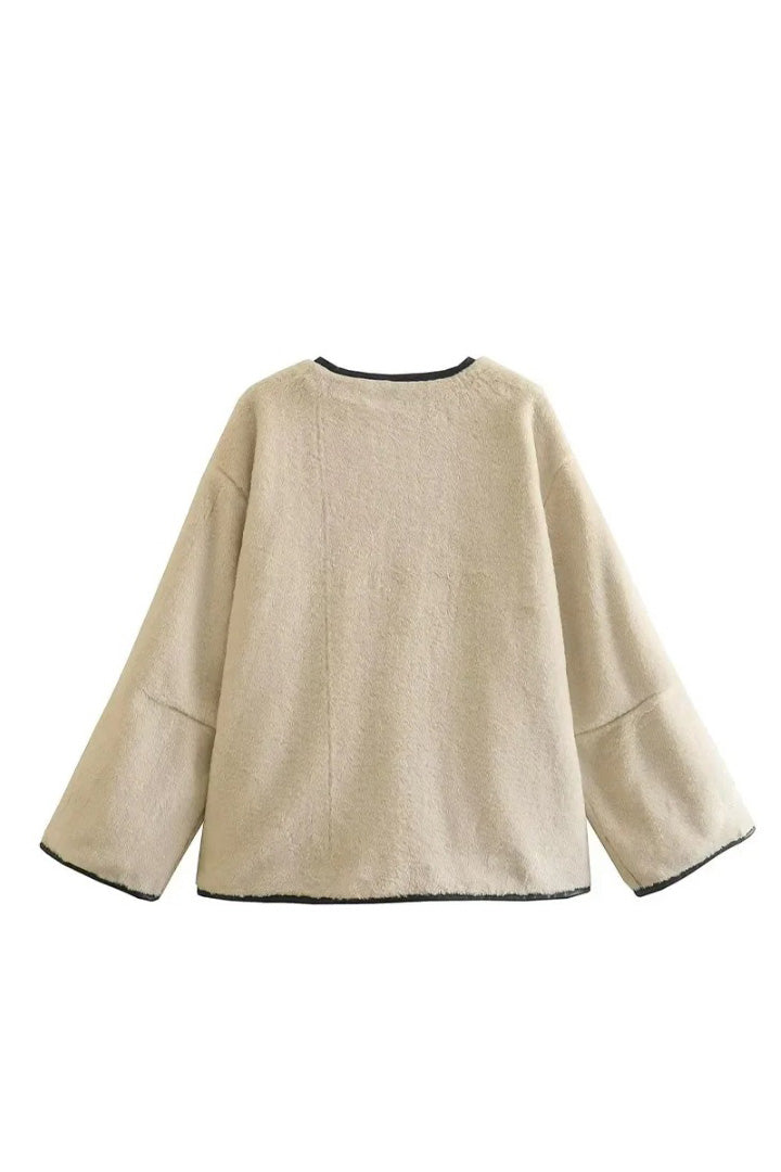 Khaki - Women's heavyweight cream faux shearling jacket featuring a collarless neckline, black toggle closures, contrast black piping, and an oversized fit.