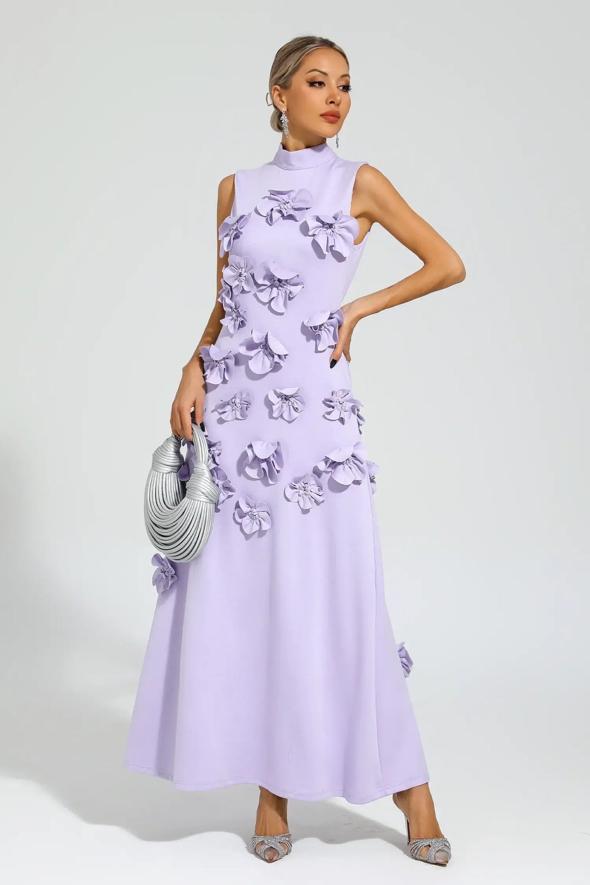 Woman in pink crepe gown with 3D floral appliques