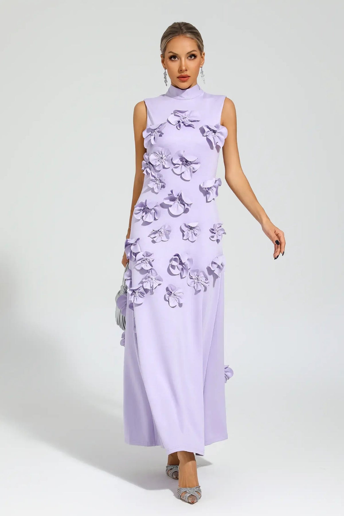 Woman in pink crepe gown with 3D floral appliques