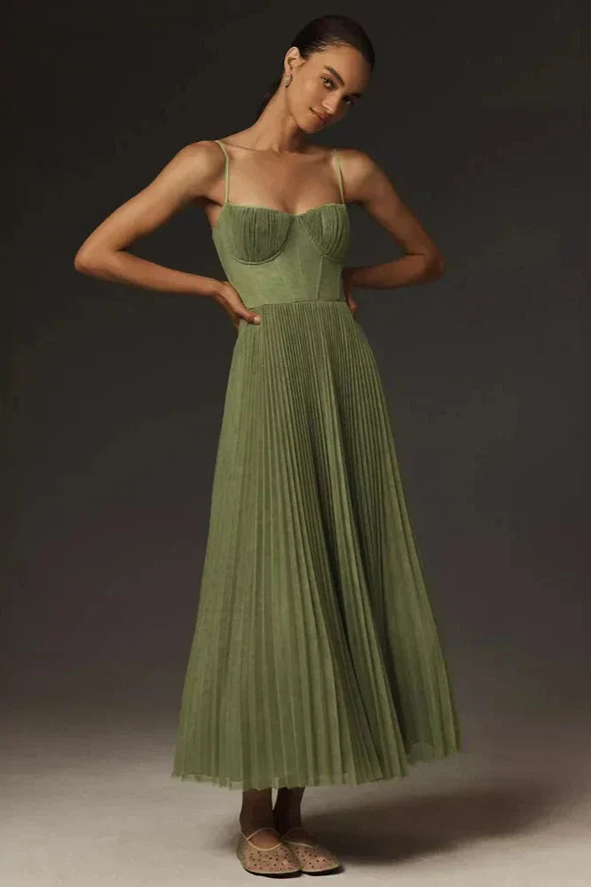 Woman in olive green pleated tulle dress