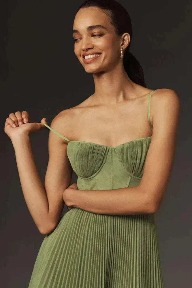 Woman in olive green pleated tulle dress