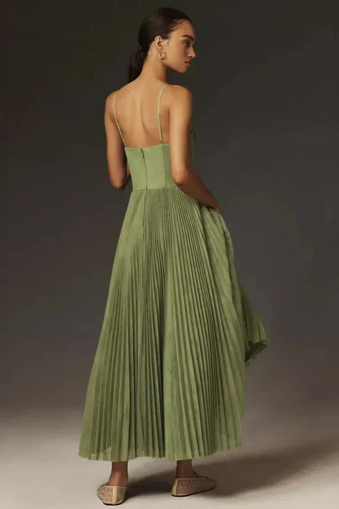 Woman in olive green pleated tulle dress