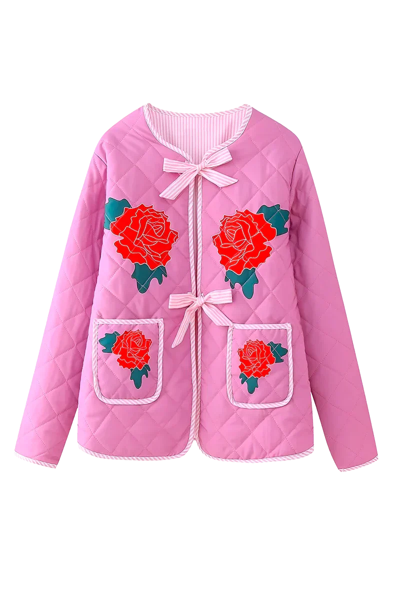 Pink - Women's pink diamond-quilted jacket featuring large red rose appliqués, striped tie-front closures, and matching piped edges, worn over a white top and pink striped shorts.