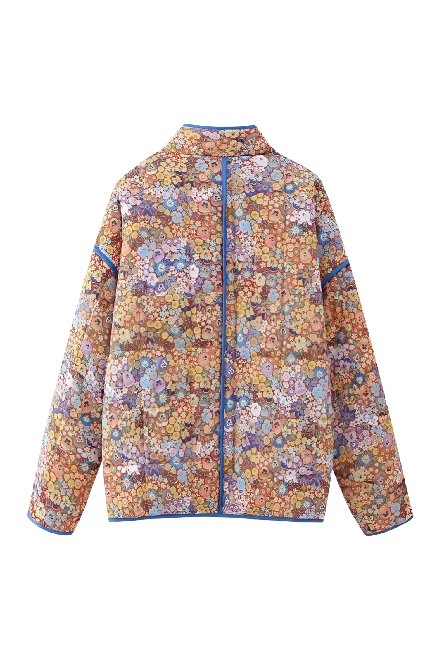Women's relaxed-fit quilted jacket featuring a vibrant floral print, contrast blue binding on the edges and cuffs, and front patch pockets, worn open.