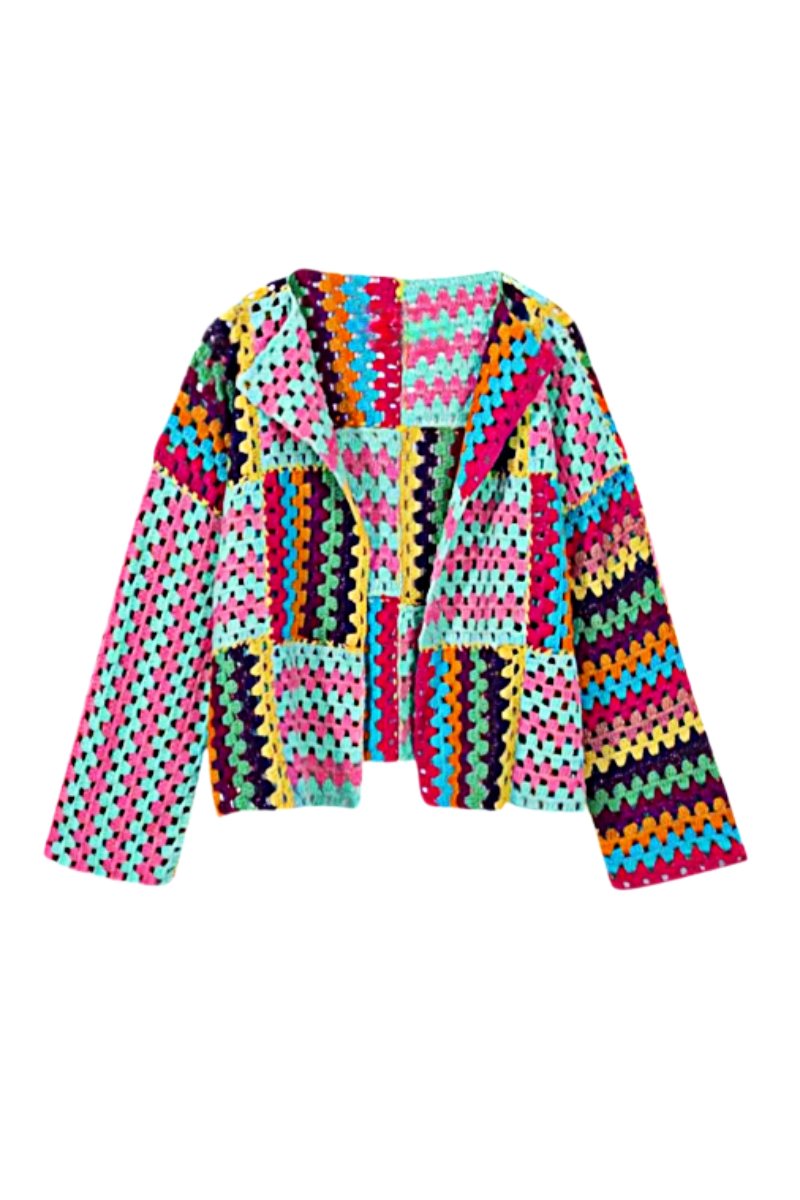 Multicolor - A woman taking a mirror selfie wearing an oversized, multicolour patchwork crochet cardigan over a white top and blue jeans, holding a woven straw tote bag.