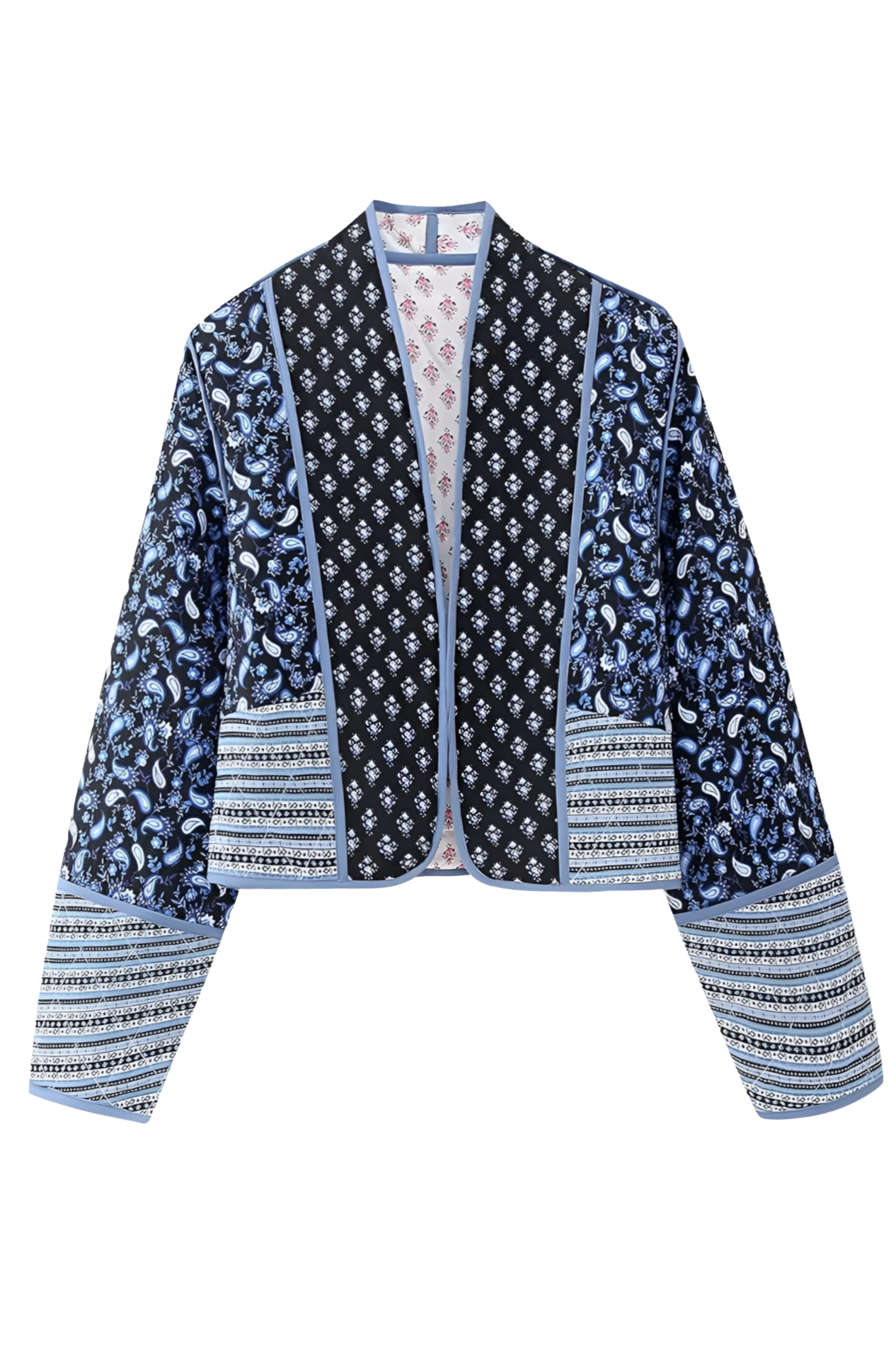Blue - Women's open-front quilted jacket featuring a pink and white floral block print, contrasting blue edge binding, and diamond stitching, worn over a white tee and light wash jeans.