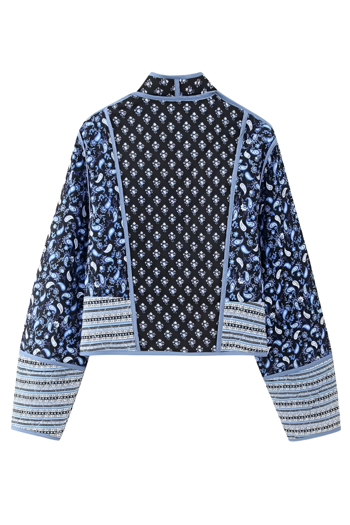 Blue - Women's open-front quilted jacket featuring a pink and white floral block print, contrasting blue edge binding, and diamond stitching, worn over a white tee and light wash jeans.