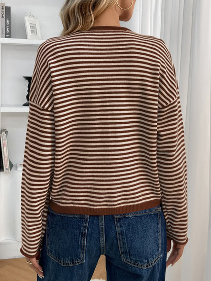 Brown - Women's brown and white striped knit cardigan with button-front closure, styled open over a white crop top and denim jeans.