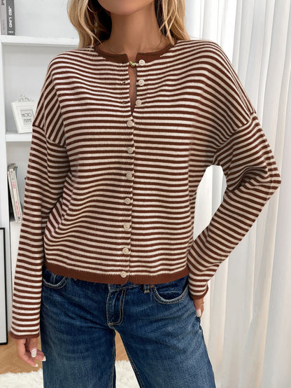 Brown - Women's brown and white striped knit cardigan with button-front closure, styled open over a white crop top and denim jeans.