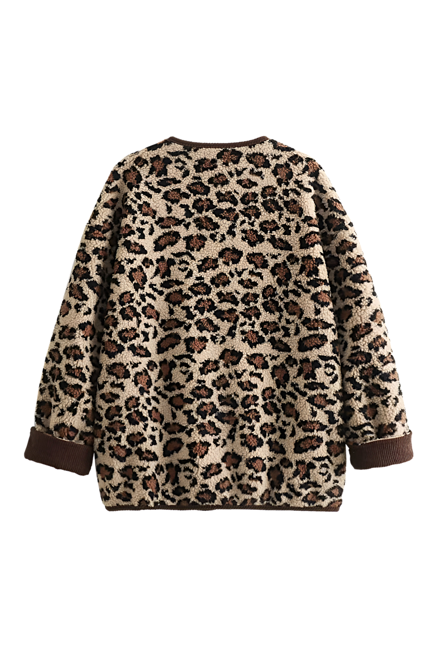 A woman wearing a relaxed-fit, fuzzy knit cardigan featuring a bold leopard print and contrasting dark ribbed placket, styled open over a white top and blue jeans.