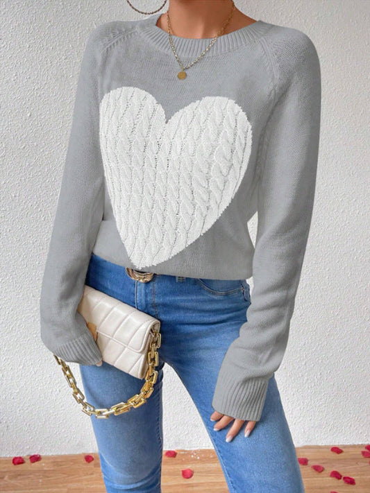 Grey - Women's crew neck knit sweater featuring a large contrasting cable-knit heart motif on the front, complete with raglan sleeves and ribbed trims.