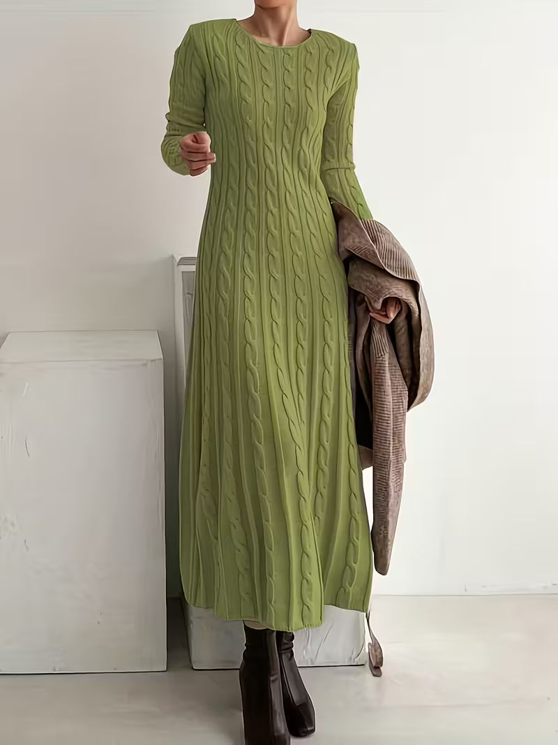 Green - Woman wearing a heavyweight long sleeve cable knit maxi dress with an A-line silhouette
