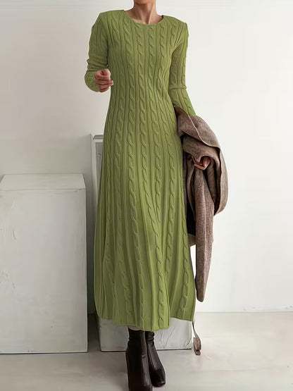 Green - Woman wearing a heavyweight long sleeve cable knit maxi dress with an A-line silhouette
