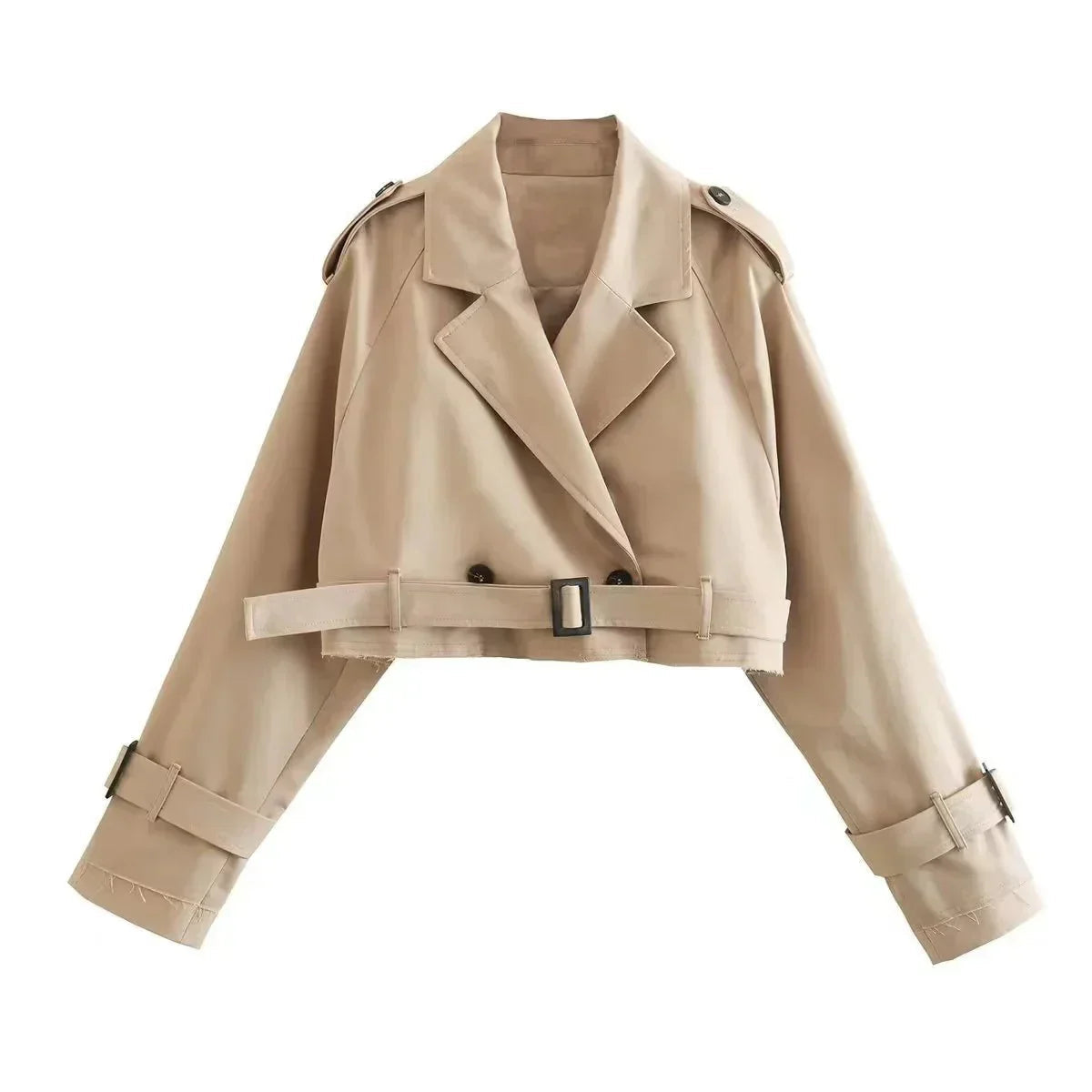 Beige - Women's beige cropped trench jacket featuring a frayed raw hem, wide lapels, and belted cuffs, styled open over a white top and blue jeans.