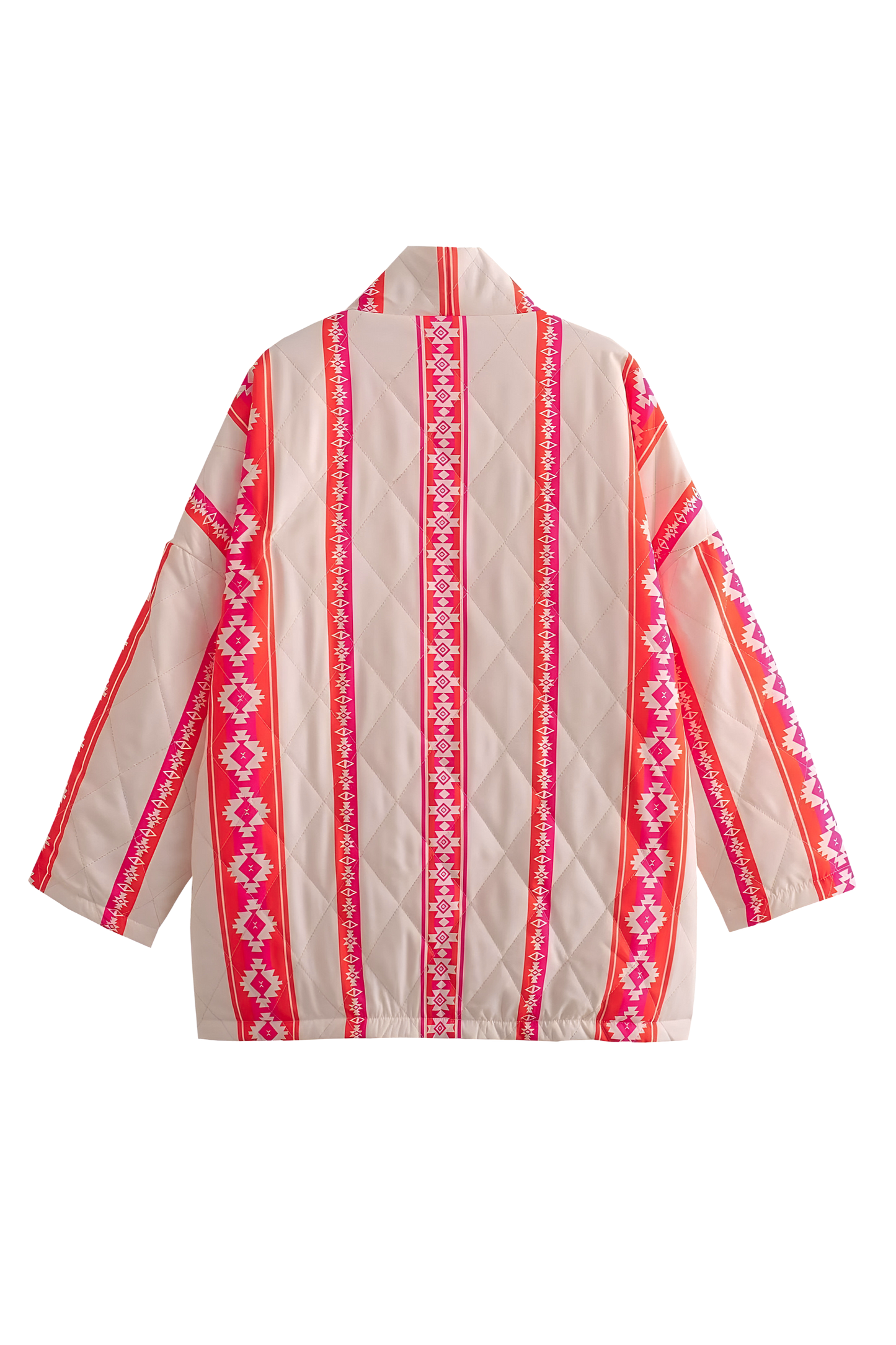 A woman wearing a relaxed, open-front kimono jacket featuring a vibrant pink and orange geometric Aztec print over a cream base, styled over a crochet crop top and shorts.