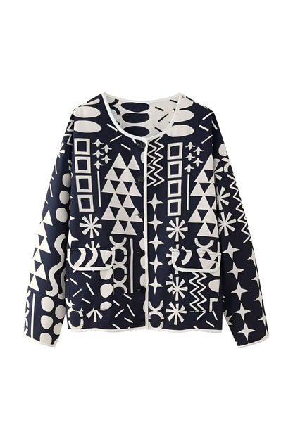 Dark Blue - Woman wearing a navy blue quilted open-front jacket with bold white abstract geometric embroidery, styled with jeans and sandals.