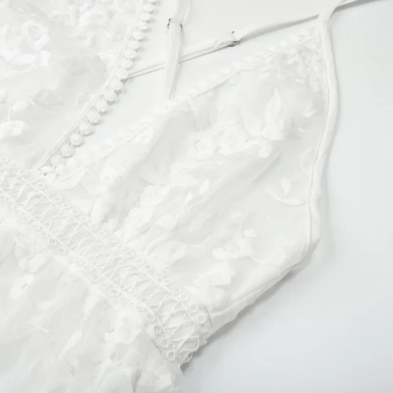 White - White floral appliqué tulle mini dress featuring a deep plunge neckline, crochet-trimmed waist, and a fluid A-line skirt.