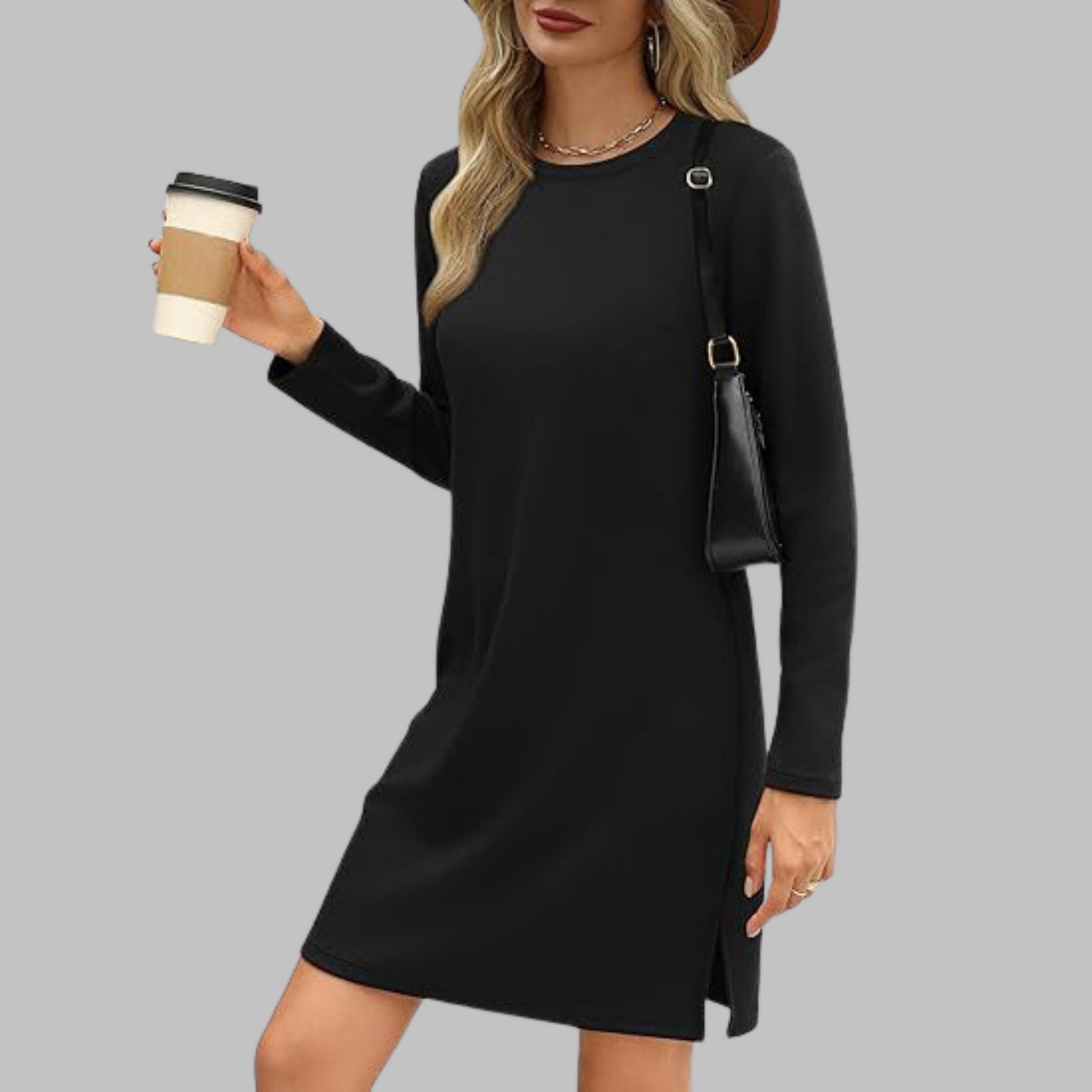Black - Woman wearing a solid long sleeve jersey shift mini dress with side hem slits