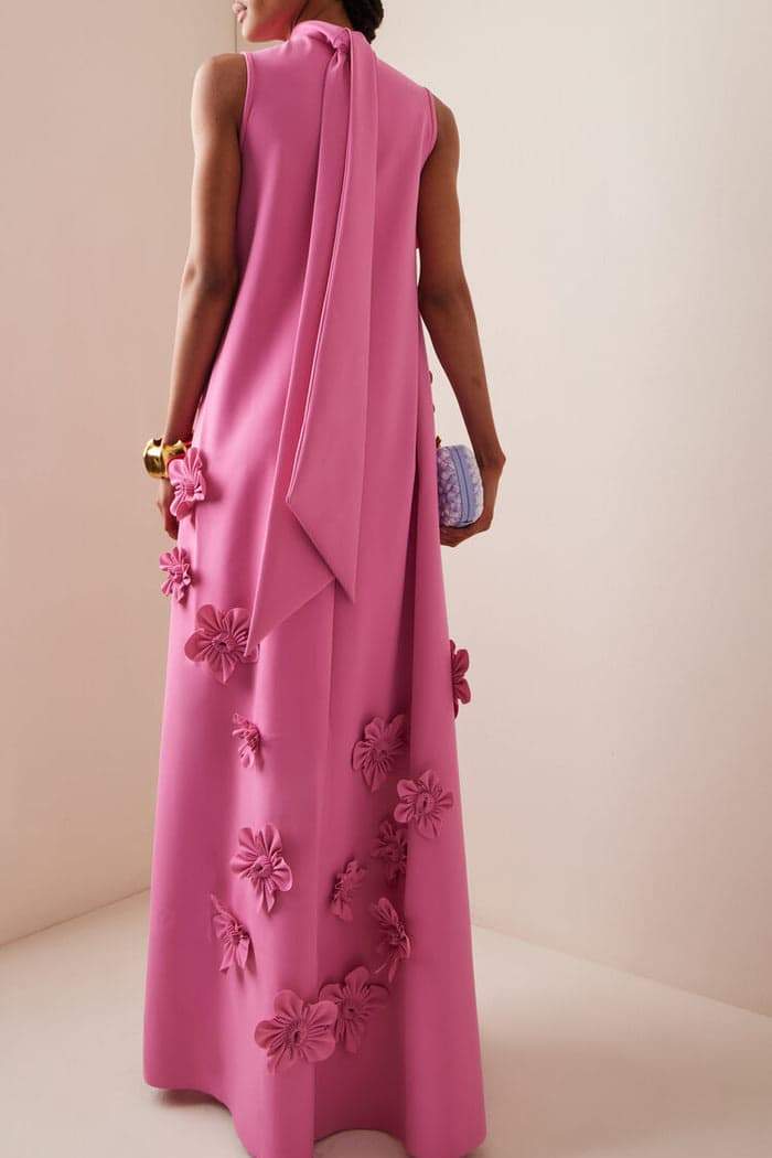 Woman in pink crepe gown with 3D floral appliques