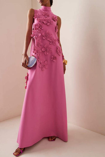 Woman in pink crepe gown with 3D floral appliques