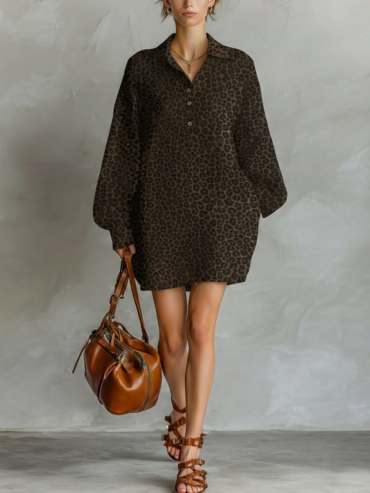 Brown - A model wears a relaxed-fit, long-sleeve mini shirt dress featuring a dark brown leopard print pattern, styled with a point collar and partial button placket.