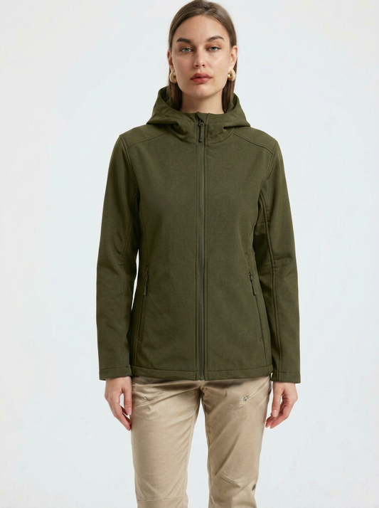 Green - A woman wearing a structured olive green matte technical hooded jacket with a front zip closure, panelled seam detailing, and zippered pockets, paired with beige trousers.