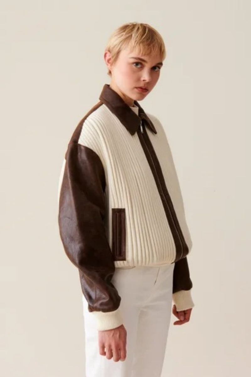 White - Women's oversized bomber jacket featuring a cream ribbed knit body with contrasting brown faux leather sleeves, collar, and zip placket.