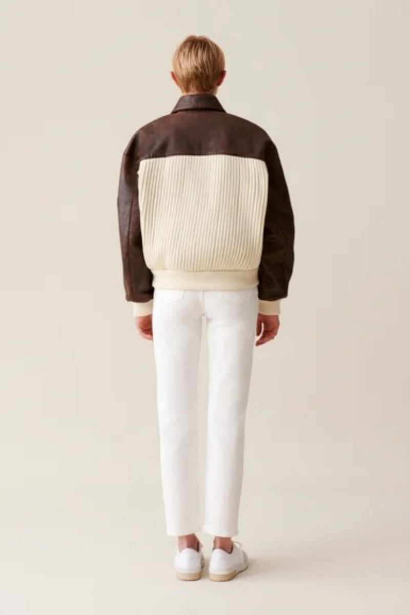 White - Women's oversized bomber jacket featuring a cream ribbed knit body with contrasting brown faux leather sleeves, collar, and zip placket.