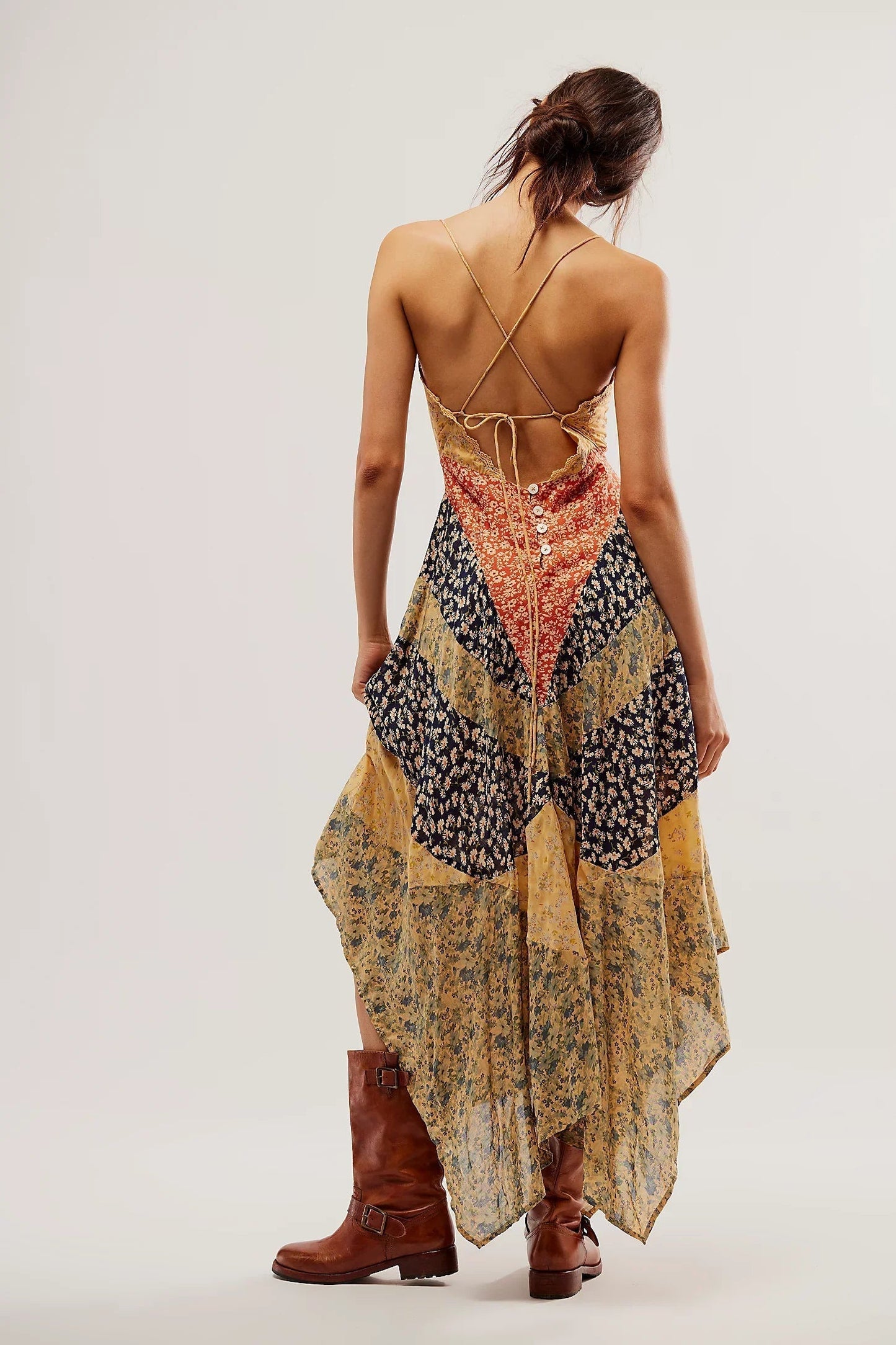 Multi - A model wearing a patchwork floral chiffon maxi dress with a lace-trimmed V-neckline and an asymmetric handkerchief hem.