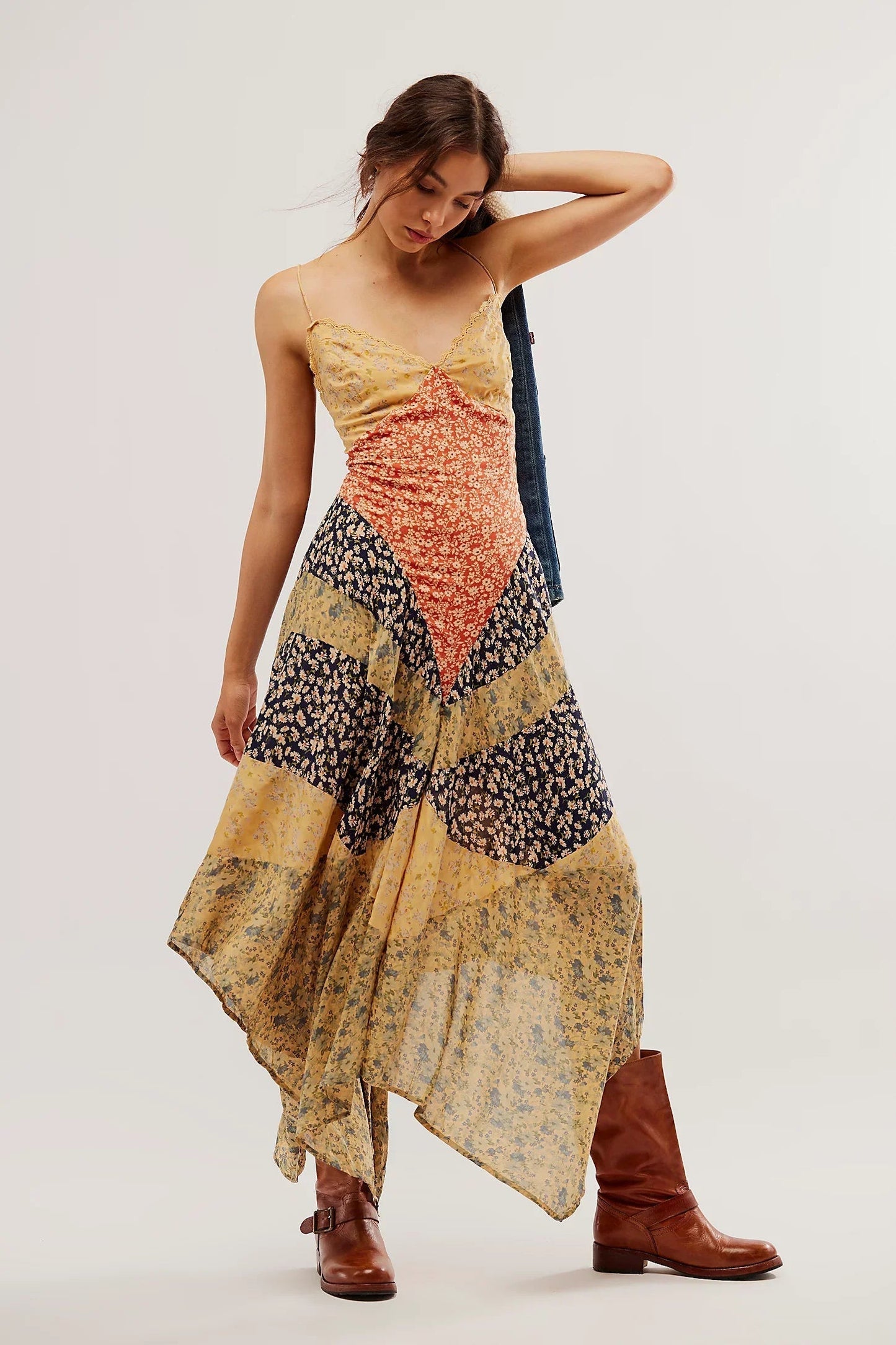 Multi - A model wearing a patchwork floral chiffon maxi dress with a lace-trimmed V-neckline and an asymmetric handkerchief hem.