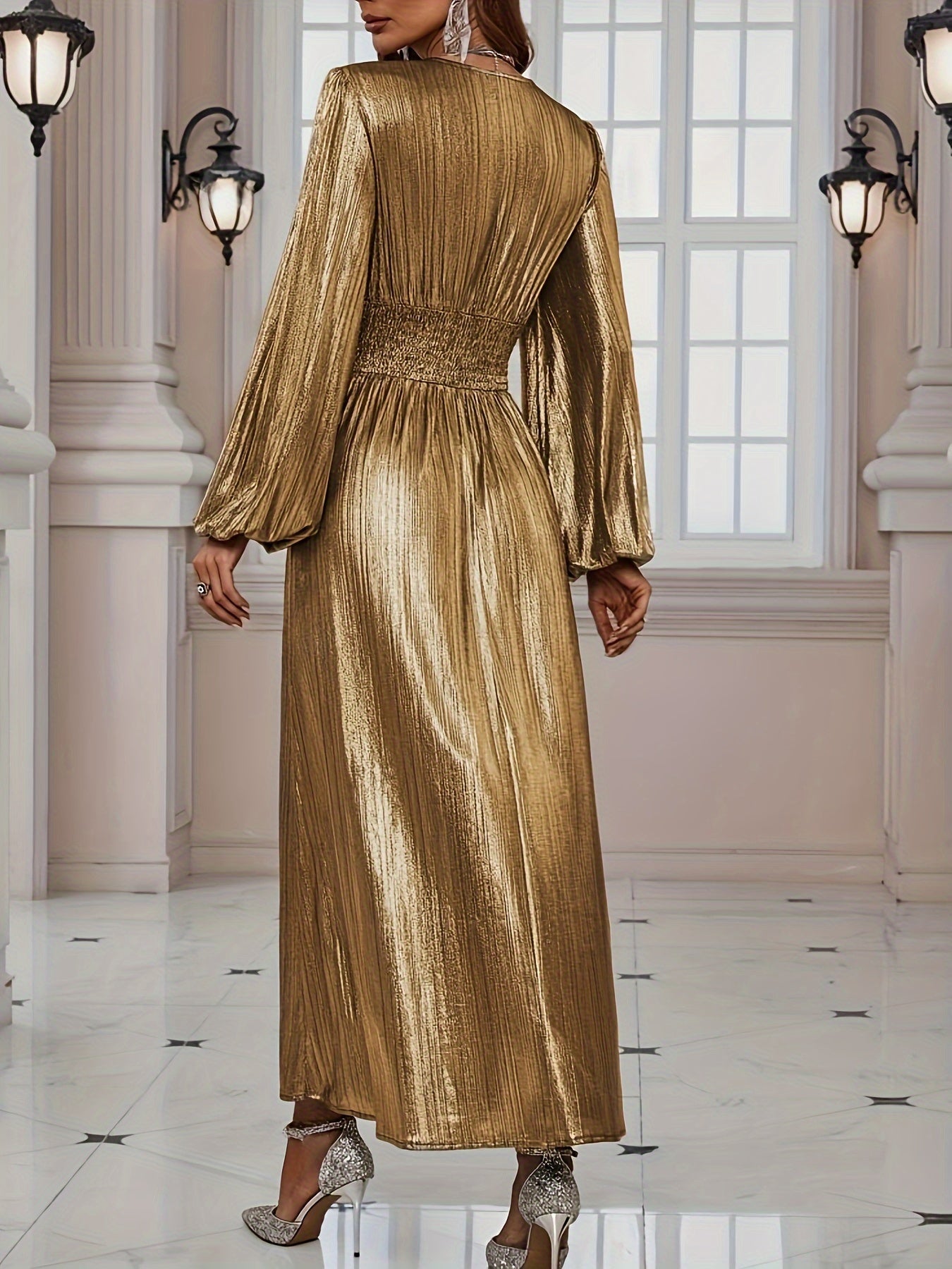 Red - Woman wearing a shiny metallic pleated long sleeve maxi dress with a wrap bodice, banded waist, and high leg slit, standing in a formal indoor setting.