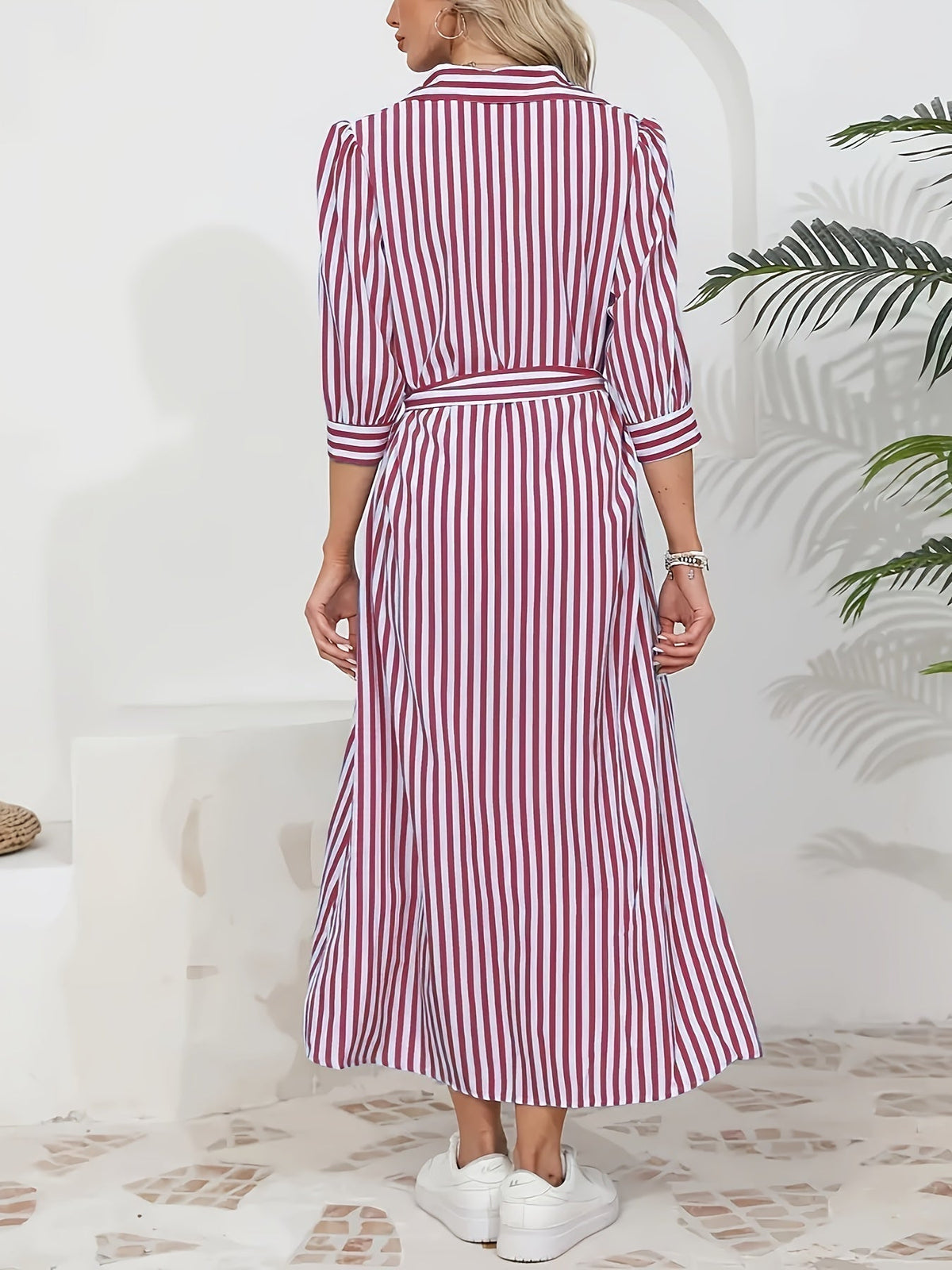 Black - Woman wearing a striped poplin midi shirt dress with 3/4 sleeves, a collared neckline, and a tie waist, styled with white trainers.