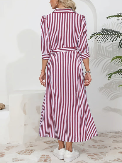 Black - Woman wearing a striped poplin midi shirt dress with 3/4 sleeves, a collared neckline, and a tie waist, styled with white trainers.