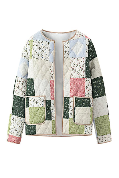 A woman wearing a quilted patchwork jacket with floral and solid panels, styled over a beige shirt and pink textured mini skirt.