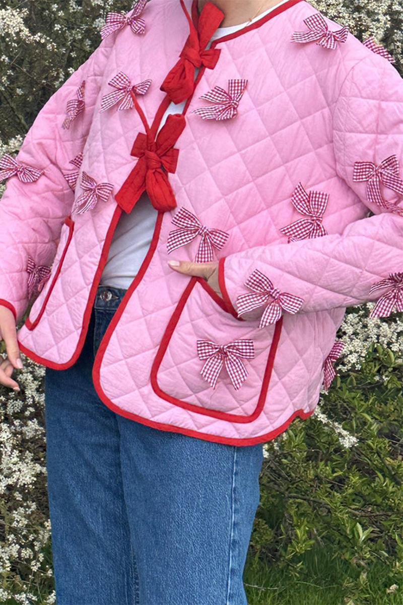 Pink - Women's pink diamond-quilted jacket featuring red contrast trim, red tie-front closures, and decorative red and white gingham bows.