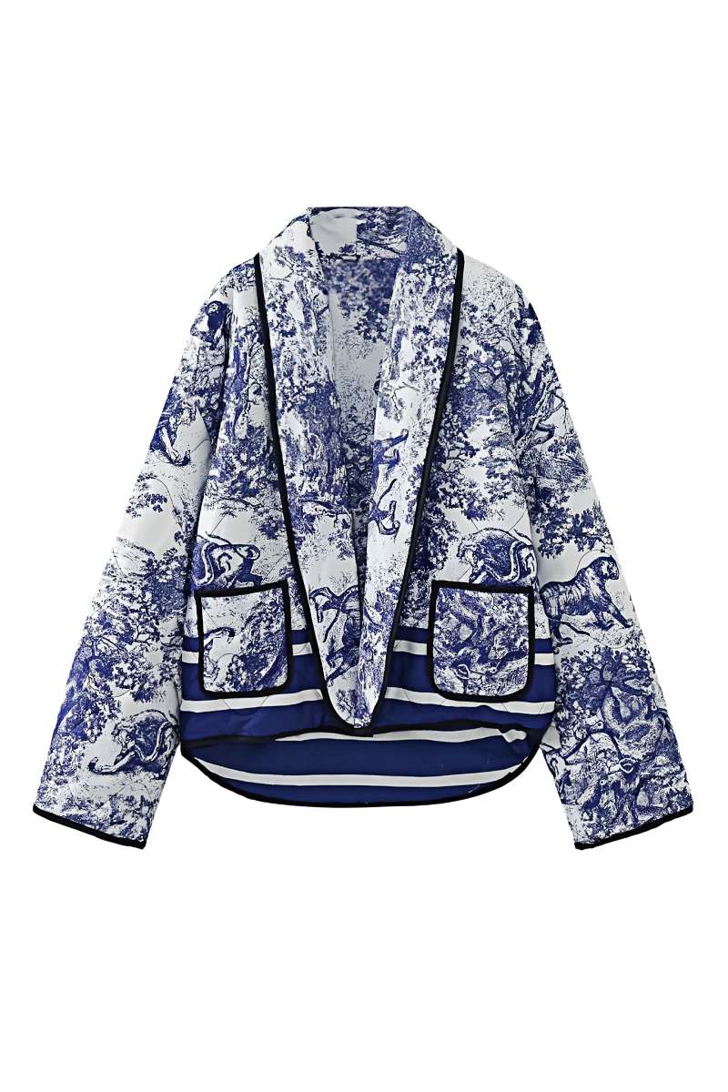 Women's oversized quilted jacket featuring a navy and white toile scenic print, open front, and contrast striped borders on the wide sleeves and hem.