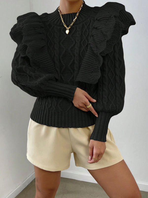 Black - Women's cream chunky cable knit sweater featuring dramatic oversized ruffles on the shoulders and a ribbed crew neckline, styled with beige shorts and a brown belt.