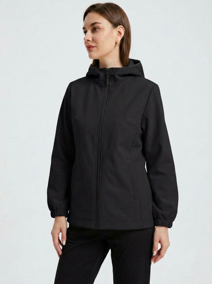 Black - A woman wearing a cream-coloured structured hooded jacket with a contrast black front zipper, elasticised cuffs, and side pockets, paired with black pants.