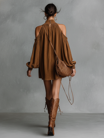 Photo Color - A model wears a brown suede-look mini shift dress featuring a gathered high neck, cold-shoulder cut-outs, and long balloon sleeves with shirred cuffs, paired with embroidered knee-high boots.