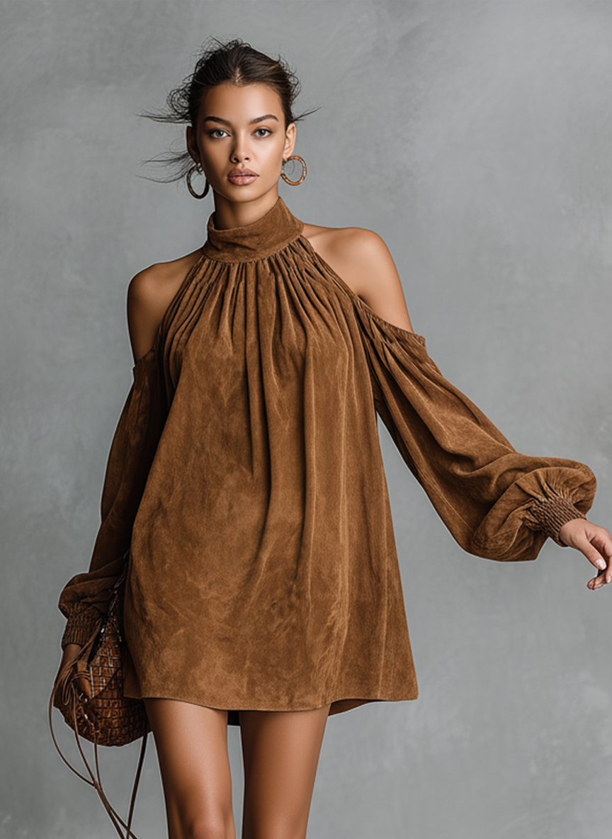 Pink - A model wears a brown suede-look mini shift dress featuring a gathered high neck, cold-shoulder cut-outs, and long balloon sleeves with shirred cuffs, paired with embroidered knee-high boots.