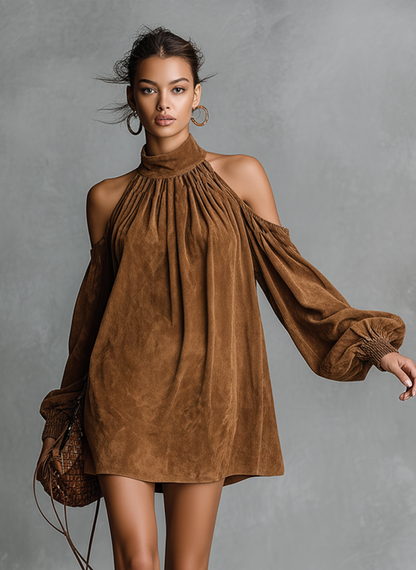 Pink - A model wears a brown suede-look mini shift dress featuring a gathered high neck, cold-shoulder cut-outs, and long balloon sleeves with shirred cuffs, paired with embroidered knee-high boots.