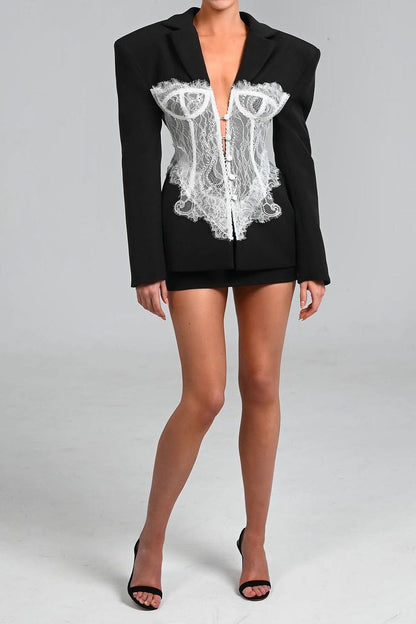 Black - Tailored long-sleeve mini blazer dress featuring strong shoulders, notched lapels, and a prominent sheer lace corset overlay with center button detailing