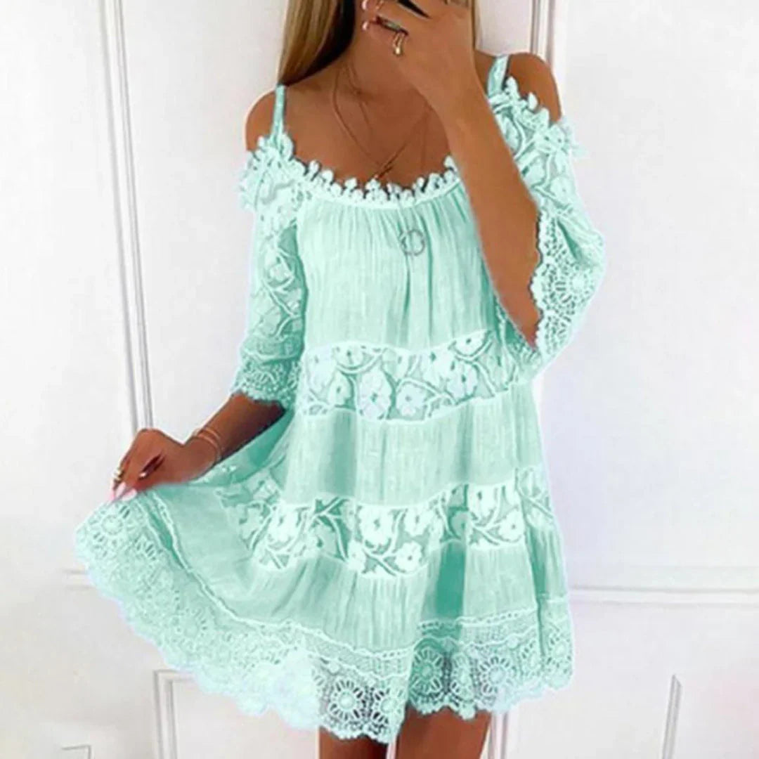 Green - Women's pale yellow cold-shoulder mini dress featuring a tiered silhouette and extensive floral lace panelling across the bodice, sleeves, and hem.