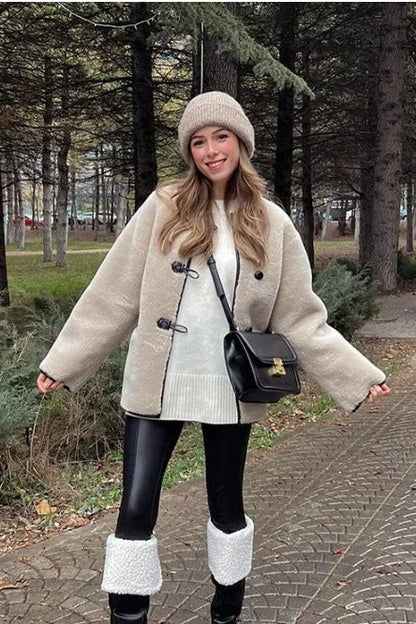 Khaki - Women's heavyweight cream faux shearling jacket featuring a collarless neckline, black toggle closures, contrast black piping, and an oversized fit.