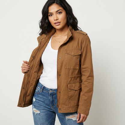 Brown - A woman wearing a structured olive green twill utility jacket with four front flap pockets, a funnel neck, and a zip-front closure, styled over a white t-shirt and blue jeans.
